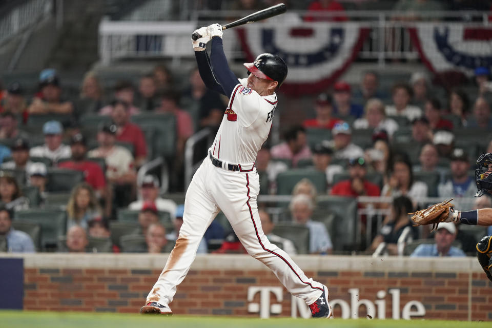 Atlanta Braves' Freddie Freeman (5) hits a solo homer against the Milwaukee Brewers during the eighth inning of Game 4 of a baseball National League Division Series, Tuesday, Oct. 12, 2021, in Atlanta. (AP Photo/Brynn Anderson)