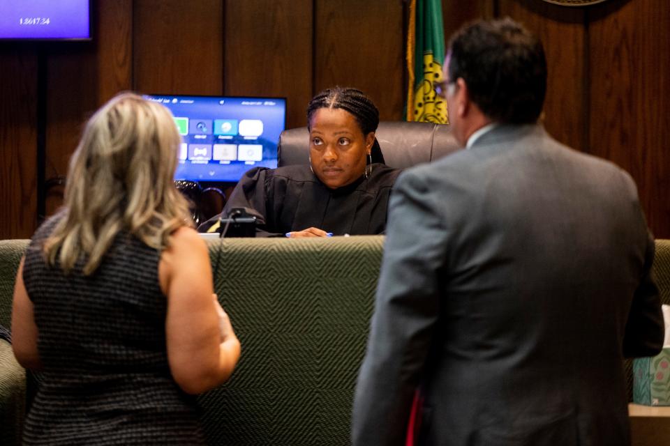 Jessica Van Dyke (left), the lead counsel and executive director of the Tennessee Innocence Project, and Shelby County Assistant District Attorney Robert Gowen (right), deputy chief of the justice review unit, speak with Judge Jennifer Fitzgerald (middle) regarding the case of Artis Whitehead, who has been in jail since 2003 on charges related to the robbery of B.B. King’s in 2002, at Shelby County Criminal Court on Tuesday, September 26, 2023.