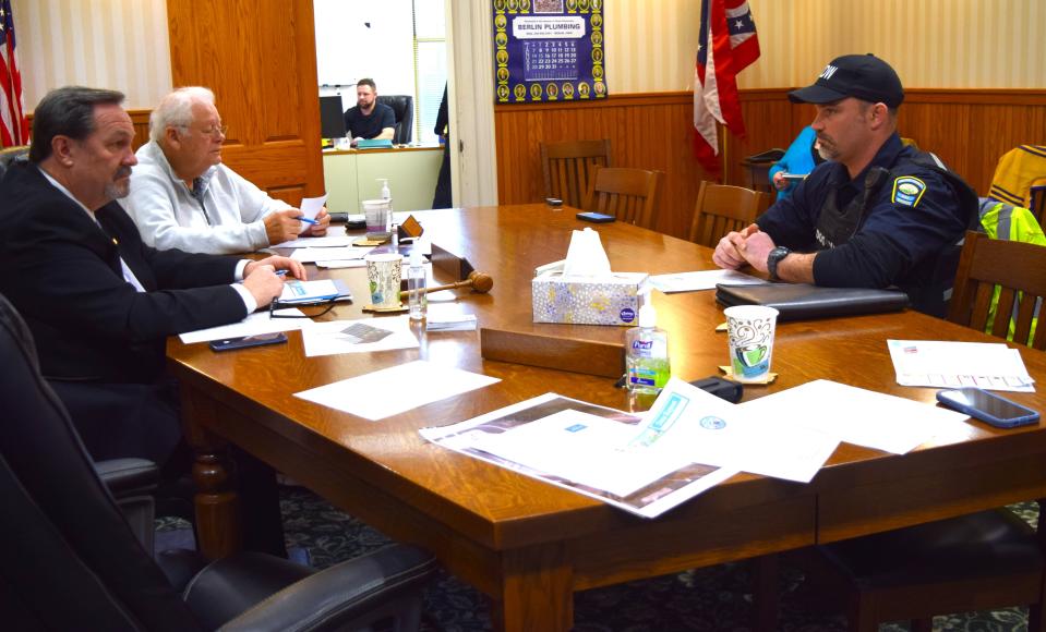 Commissioners Dave Hall and Joe Miller listen as Holmes County Dog Warden Jonathan Beam shares his annual report, which noted the shelter responded to 206 complaints in 2023. Complaints range from a neighbor's dog running at large to a dog not being cared for properly.