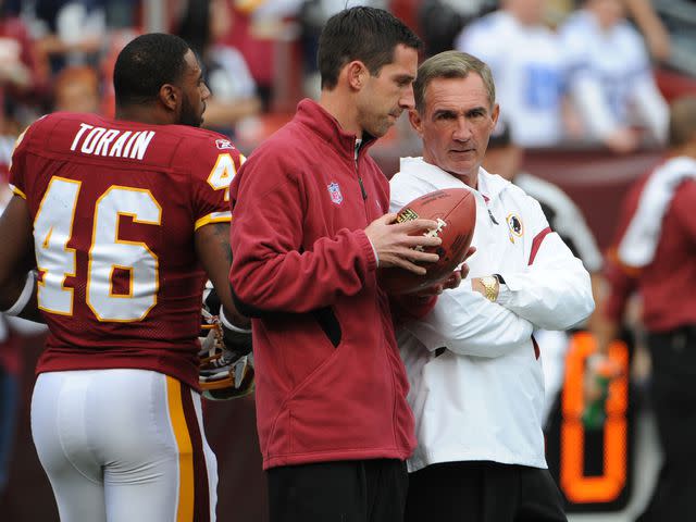<p>Jonathan Newton/The Washington Post/Getty</p> Kyle Shanahan and his father Mike Shanahan as the Redskins play the Dallas Cowboys at FedEx field on November, 20 2011.