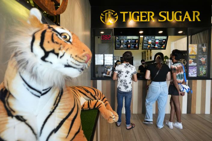 Customers order bubble tea from the counter at Tiger Sugar in Mesa on Saturday, Sept. 10, 2022. 