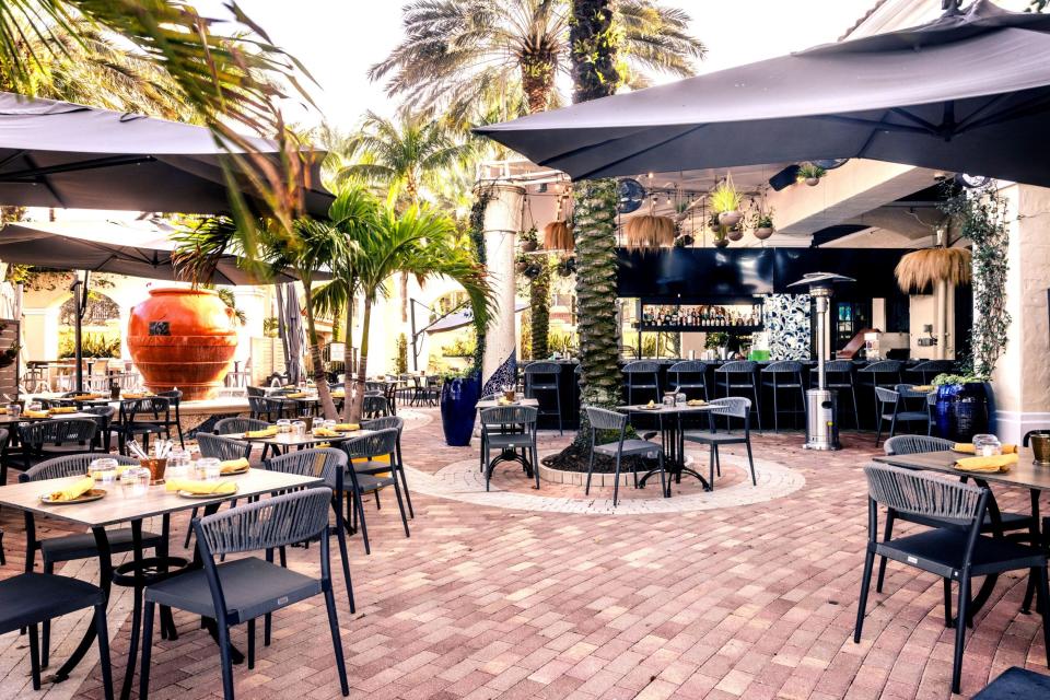 The patio at the newly relocated and renamed Ela Curry & Cocktails in Palm Beach Gardens offers a breezy space for enjoying tiki cocktails and Indian-inspired bites.