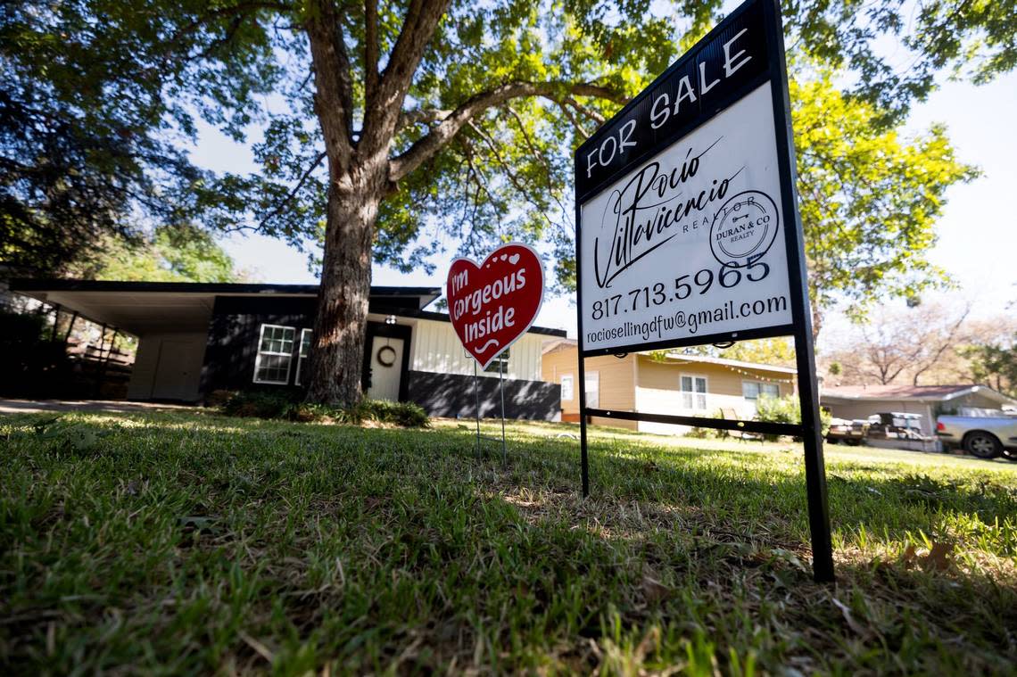 A for sale sign in front of a home in Arlington Heights neighborhood in Fort Worth.
