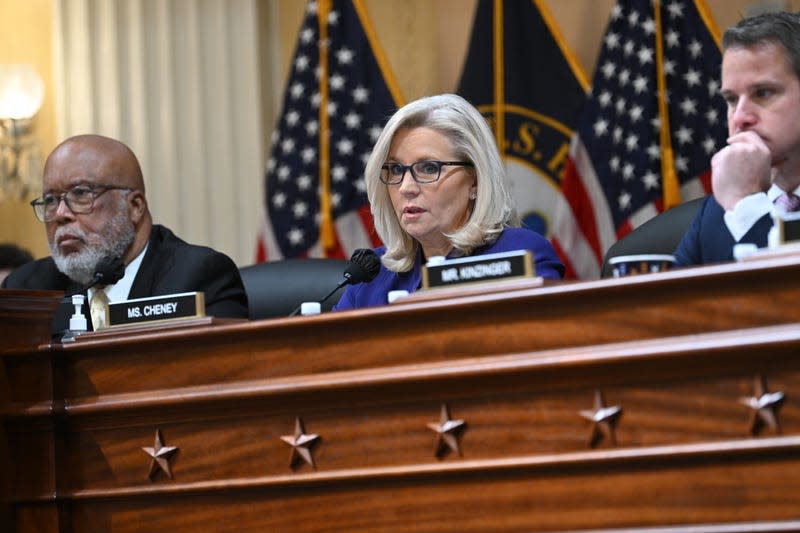 WASHINGTON, DC - DECEMBER 19: January 6th Committee chair, U.S. Representative Bennie Thompson (D-MS), looks on as U.S. Representative Liz Cheney (R-WY) speaks while U.S. Representative Adam Kinzinger (R-IL) looks on as the committee meets for their final session at the Cannon House Office Building where the January 6th Committee on Monday December 19, 2022 in Washington, DC.