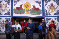 Tibetan visitors step into a courtyard at the Potala Palace in Lhasa in western China's Tibet Autonomous Region, as seen during a rare government-led tour of the region for foreign journalists, Tuesday, June 1, 2021. Long defined by its Buddhist culture, Tibet is facing a push for assimilation and political orthodoxy under China's ruling Communist Party. (AP Photo/Mark Schiefelbein)