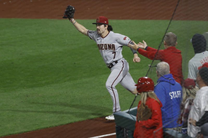 Arizona Diamondbacks right fielder Corbin Carroll holds the ball after making the final catch in Game 7 of the National League Championship Series, clinching a win over the Philadelphia Phillies on Tuesday at Citizens Bank Park in Philadelphia. Photo by Laurence Kesterson/UPI