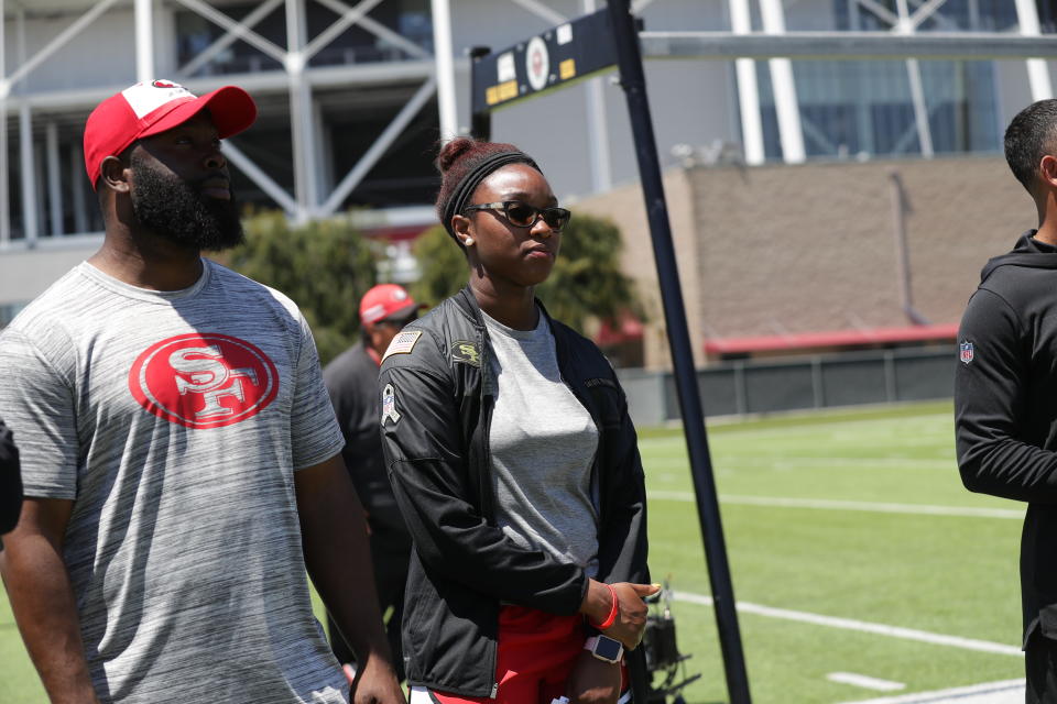 Salli Clavelle, standing with director of pro personnel Ran Carthon, has been with the 49ers since 2018. (Photo courtesy of the San Francisco 49ers)