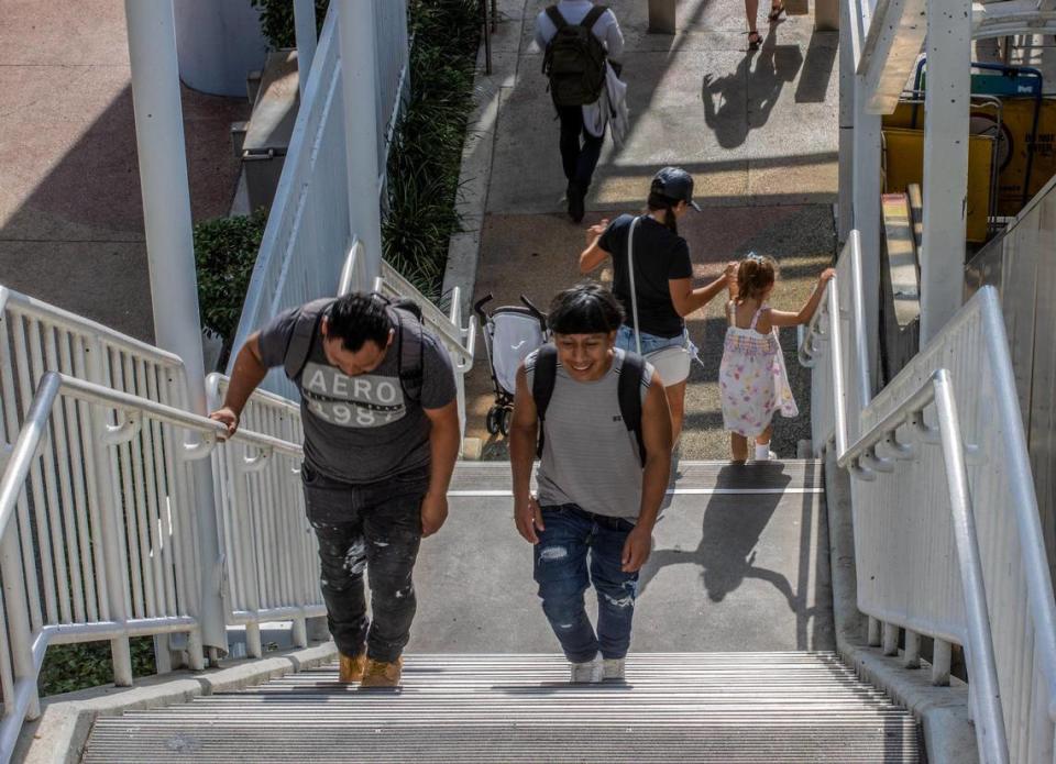 Metromover users are forced to walk down the stairs on Tuesday, May 16, 2023, at the Adrienne Arsht Center Station in Miami with the elevator and escalator broken. Pedro Portal/pportal@miamiherald.com