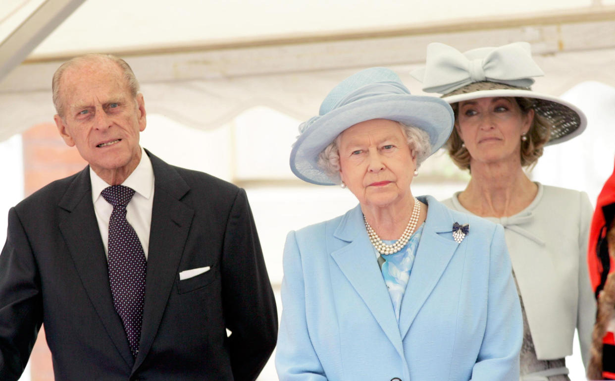 Britain's Queen Elizabeth II stand wwith the Duke of Edinburgh and Lady Brabourne, formerly Penny Romsey (right) outside Romsey Abbey, Hampshire, where she attended a service to mark the 400th anniversary of the market town's Royal Charter.   (Photo by Ian Jones - PA Images/PA Images via Getty Images)