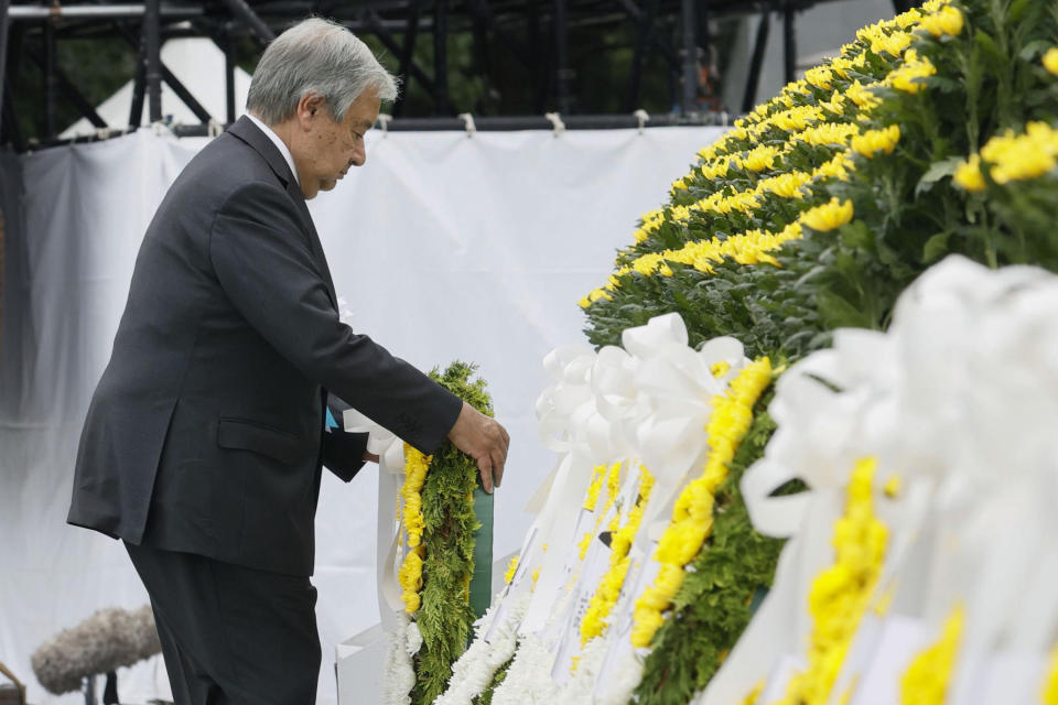 U.N. Secretary General Antonio Guterres lays a wreath at the cenotaph for the atomic bombing victims at the Hiroshima Peace Memorial Park during the ceremony marking the 77th anniversary of the atomic bombing in the city, in Hiroshima, western Japan Saturday, Aug. 6, 2022. (Kenzaburo Fukuhara/Kyodo News via AP)