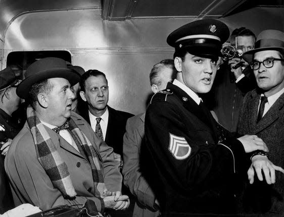 Elvis Presley (right) and Colonel Tom Parker (left) in 1960. Parker died Jan. 21, 1997.