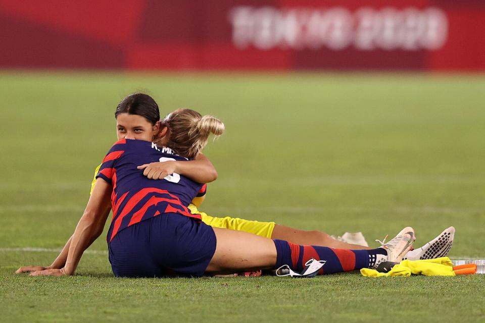 Kristie Mewis #6 of Team United States hugs Sam Kerr #2 of Team Australia