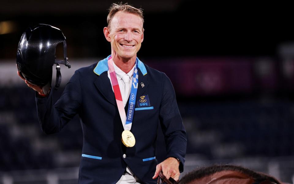 Gold medallist Peder Fredricson of Sweden celebrates - Reuters