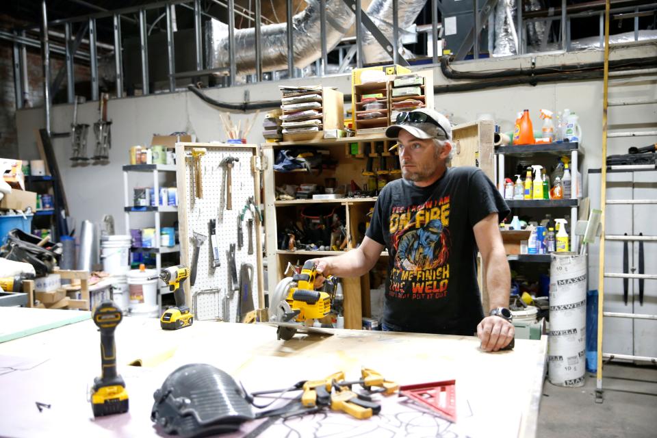 Scott Hynes works in the set shop at Carpenter Square Theatre's new home before a rehearsal for "Picasso at the Lapin Agile" at the community theater's new performance space in Oklahoma City.