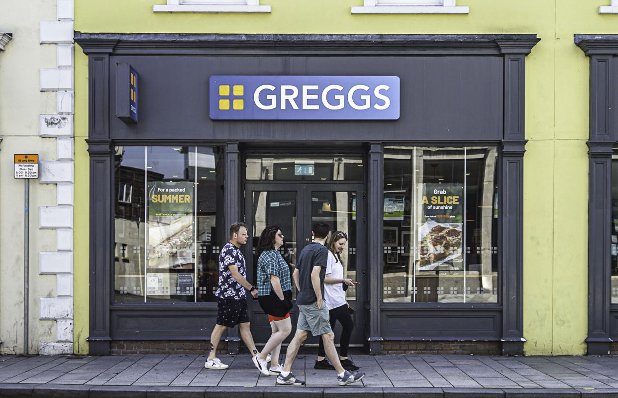 LISBURN, UNITED KINGDOM - 2021/08/06: People walk past Greggs Hot Food Store on Bow Street in Lisburn. (Photo by Michael McNerney/SOPA Images/LightRocket via Getty Images)