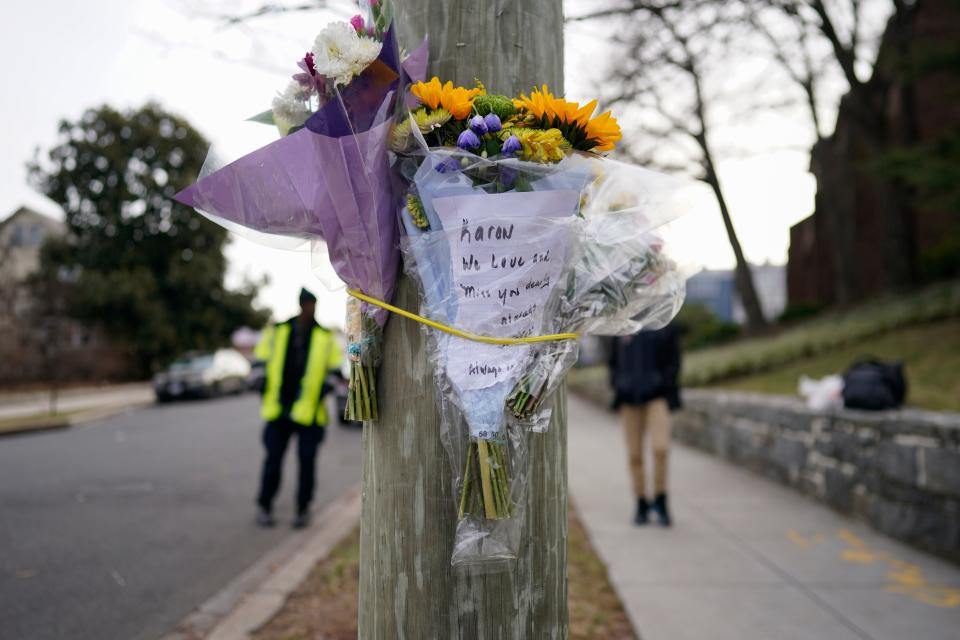 Flowers were secured to a pole as a memorial to Karon Blake, 13, on the corner of Quincy Street NE and Michigan Avenue NE in the Brookland neighborhood of Washington, Tuesday, Jan. 10, 2023.