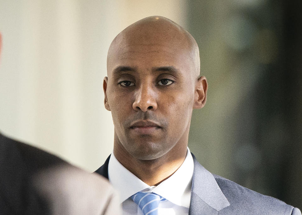 FILE - In this Friday, April 26, 2019, file photo, former Minneapolis police officer Mohamed Noor walks to court in Minneapolis. The city of Minneapolis is paying $20 million to settle a lawsuit over Noor's fatal shooting of the unarmed Justine Ruszczyk Damond, who approached his squad car after calling 911 to report a possible crime. Mayor Jacob Frey announced the settlement Friday, three days after a jury convicted Noor of murder and manslaughter in the 2017 death of Damond. Frey called the settlement "a way for our city to move forward." (Leila Navidi/Star Tribune via AP, File)