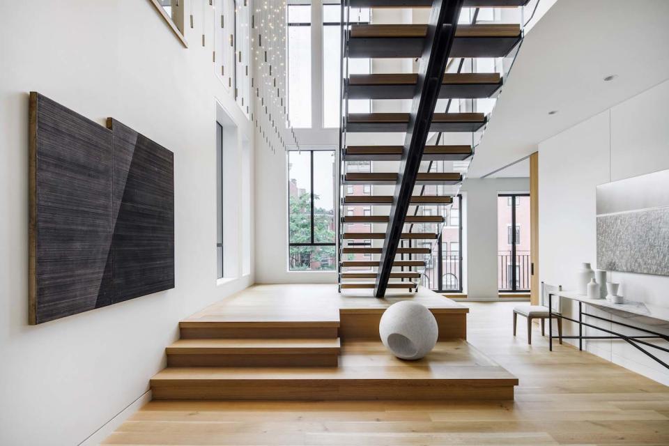 monochrome penthouse with floating staircase