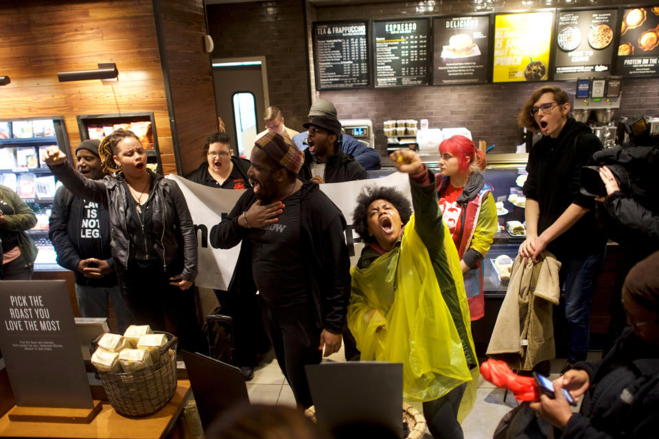 Demonstrators inside a Starbucks in Philadelphia on Monday,&nbsp;protesting after two black men were arrested in the store last week.&nbsp; (Photo: Mark Makela / Reuters)