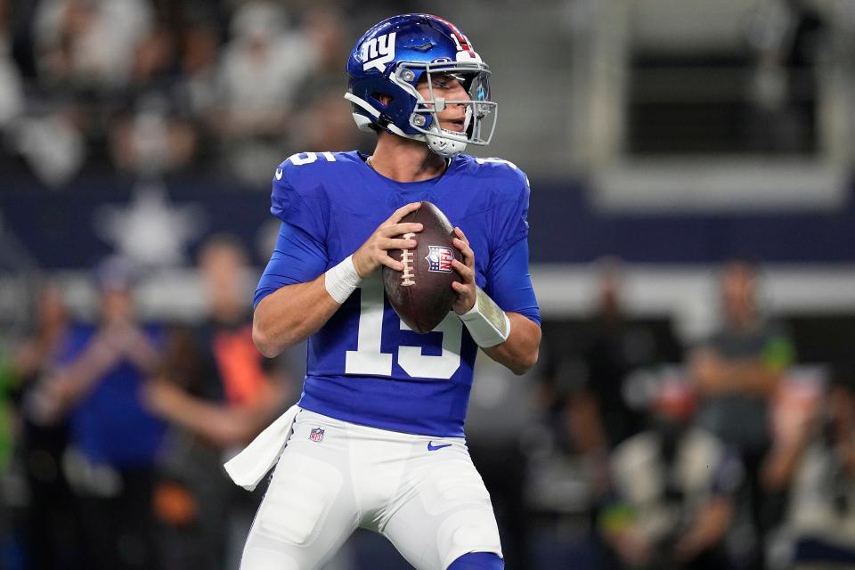 New York Giants quarterback Tommy DeVito (15) drops back to pass in the first half of an NFL football game against the Dallas Cowboys, Sunday, Nov. 12, 2023, in Arlington, Texas. (AP Photo/Tony Gutierrez)