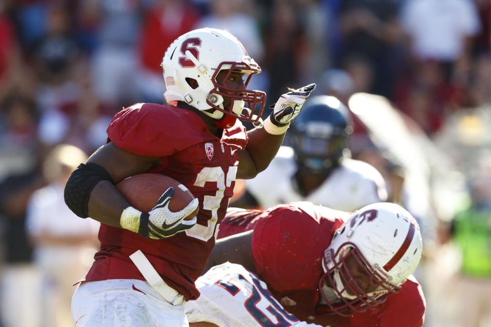 Running back Stepfan Taylor #33 of the Stanford Cardinal rushes for the game winning touchdown against the Arizona Wildcats during overtime at Stanford Stadium on October 6, 2012 in Palo Alto, California. The Stanford Cardinal defeated the Arizona Wildcats 54-48 in overtime. (Photo by Jason O. Watson/Getty Images)