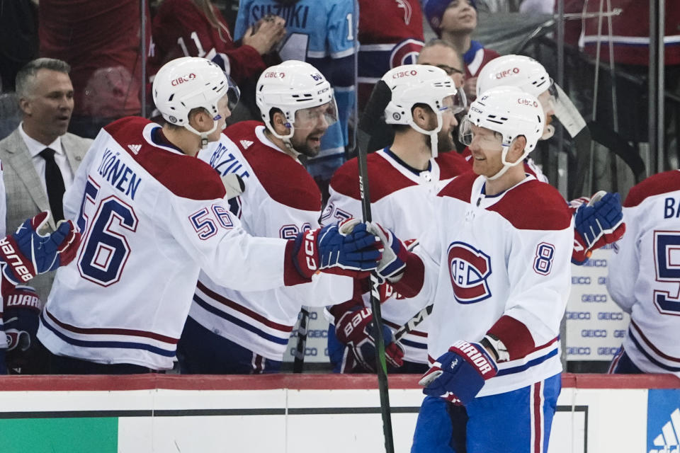 Montreal Canadiens' Mike Matheson (8) celebrates after scoring an empty-net goal during the third period of an NHL hockey game against the New Jersey Devils Tuesday, Feb. 21, 2023, in Newark, N.J. The Canadiens won 5-2. (AP Photo/Frank Franklin II)