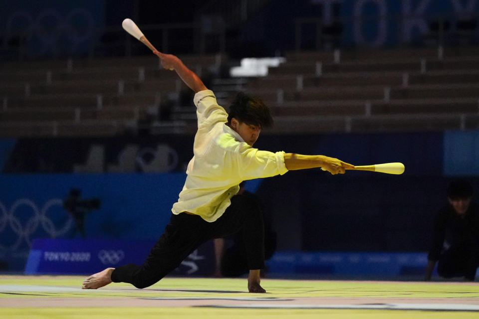 Male rhythmic gymnasts perform before the women's rhythmic gymnastics individual all-around final at the 2020 Summer Olympics, Saturday, Aug. 7, 2021, in Tokyo, Japan. (AP Photo/Ashley Landis)