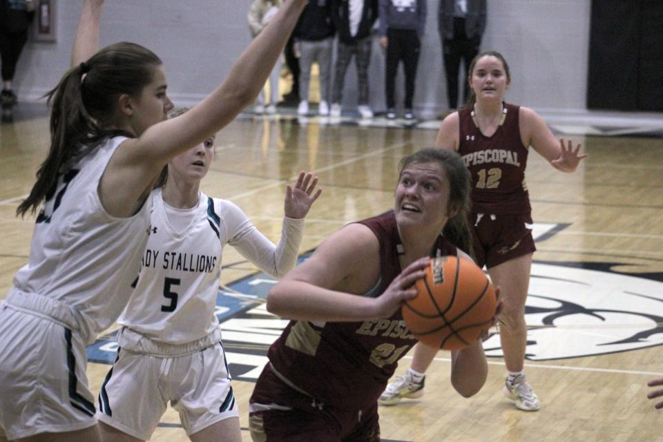 Episcopal center Kate Adams (21) looks for space to shoot against Providence during the District 3-3A girls basketball tournament.