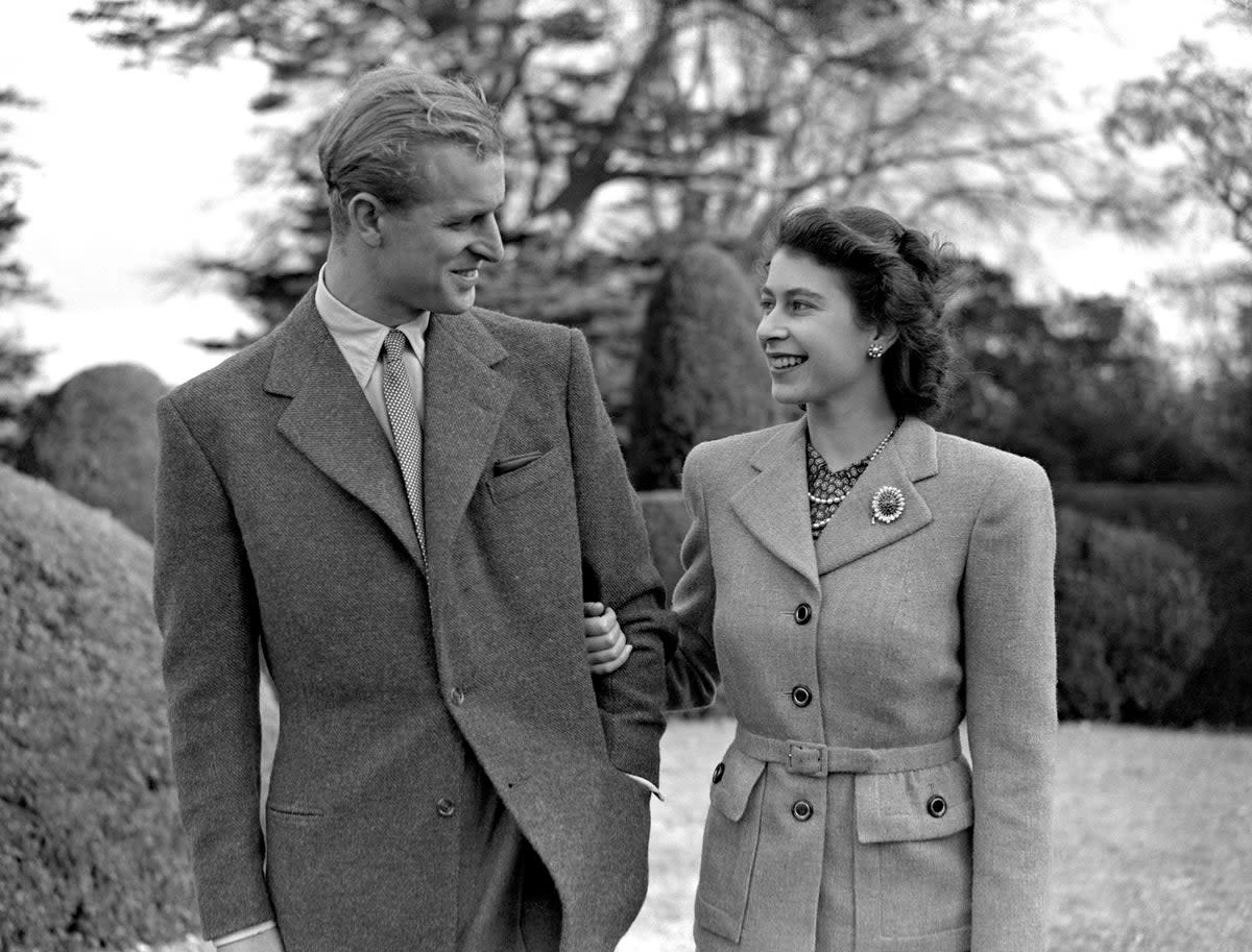 Princess Elizabeth enjoys a stroll with new husband the Duke of Edinburgh in their first public appearance since their wedding (PA) (PA Archive)