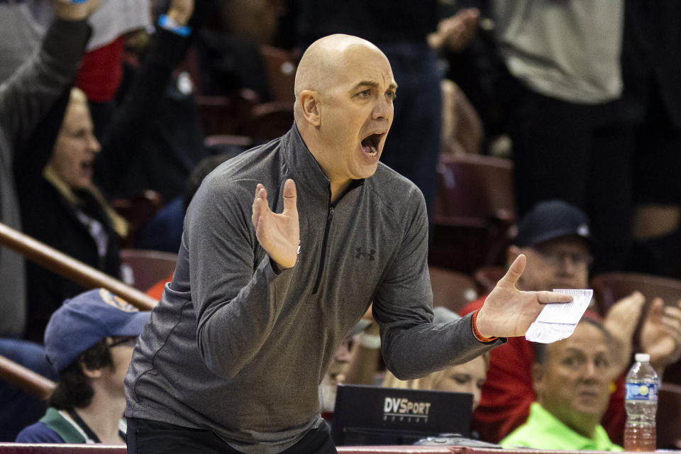 Utah's head coach Craig Smith cheers on his team in the second half of an NCAA college basketball game against Houston during the Charleston Classic in Charleston, S.C., Friday, Nov. 17, 2023. (AP Photo/Mic Smith).