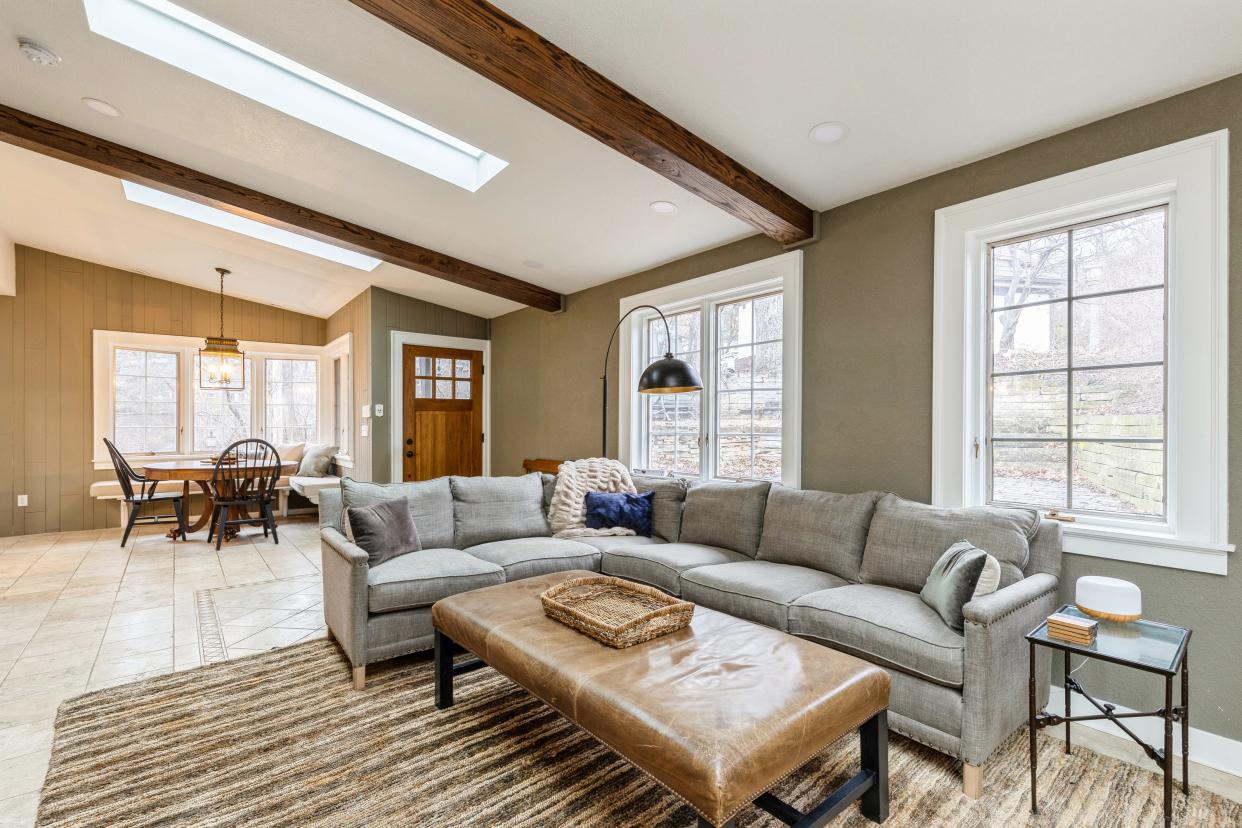 This home South of Grand features plenty of built-in charm for $598,000. The living room features wooden beams and skylights.
