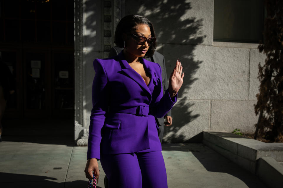 Megan Thee Stallion wearing purple suit to court.