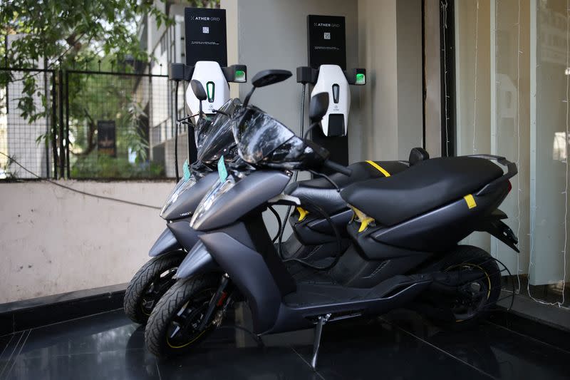 Ather electric scooters are charged outside the showroom in Mumbai