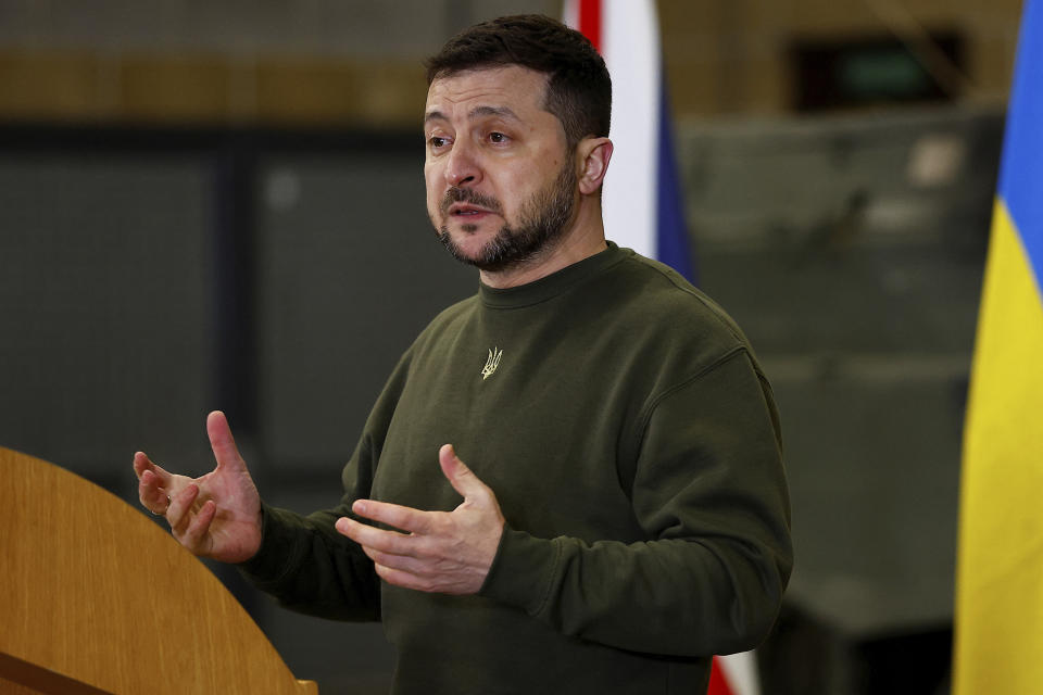 Ukrainian President Volodymyr Zelenskyy speaks at a news conference, held with British Prime Minister Rishi Sunak, at a military facility in Lulworth, Dorset, England, Wednesday Feb. 8, 2023. (Peter Nicholls/Pool via AP)
