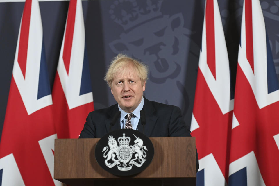 Britain's Prime Minister Boris Johnson speaks during a media briefing in Downing Street, London, Thursday, Dec. 24, 2020. Britain and the European Union have struck a provisional free-trade agreement that should avert New Year's chaos for cross-border commerce and bring a measure of certainty to businesses after years of Brexit turmoil. The breakthrough on Thursday came after months of tense and often testy negotiations that whittled differences down to three key issues: fair-competition rules, mechanisms for resolving future disputes and fishing rights. (Paul Grover/Pool Photo via AP)