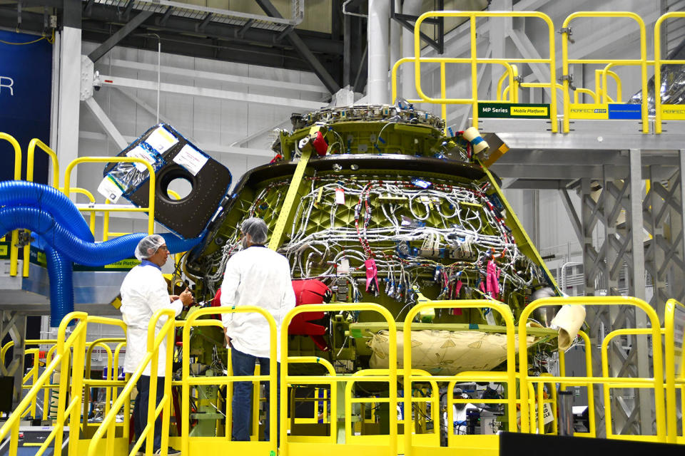 A look under the Starliner's outer skin during its initial development providing a glimpse of the complex wiring that runs throughout the spacecraft. / Credit: William Harwood/CBS News