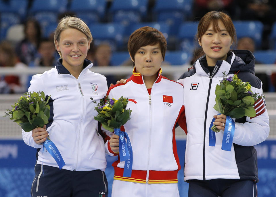 Li Jianrou of China, centre, Arianna Fontana of Italy, left, and Park Seung-hi of South Korea pose on the podium after the women's 500m short track speedskating final at the Iceberg Skating Palace during the 2014 Winter Olympics, Thursday, Feb. 13, 2014, in Sochi, Russia. Li placed first, Fontana second and Park third. (AP Photo/Vadim Ghirda)