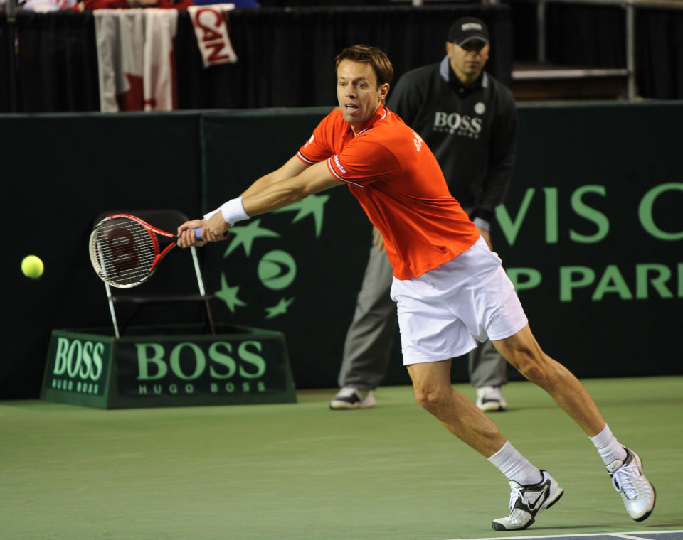 Daniel Nestor of Canada returns a serve during a Davis Cup World Group first round doubles match in Vancouver on February 11, 2012. AFP PHOTO / Don MacKinnon (Photo credit should read Don MacKinnon/AFP/Getty Images)