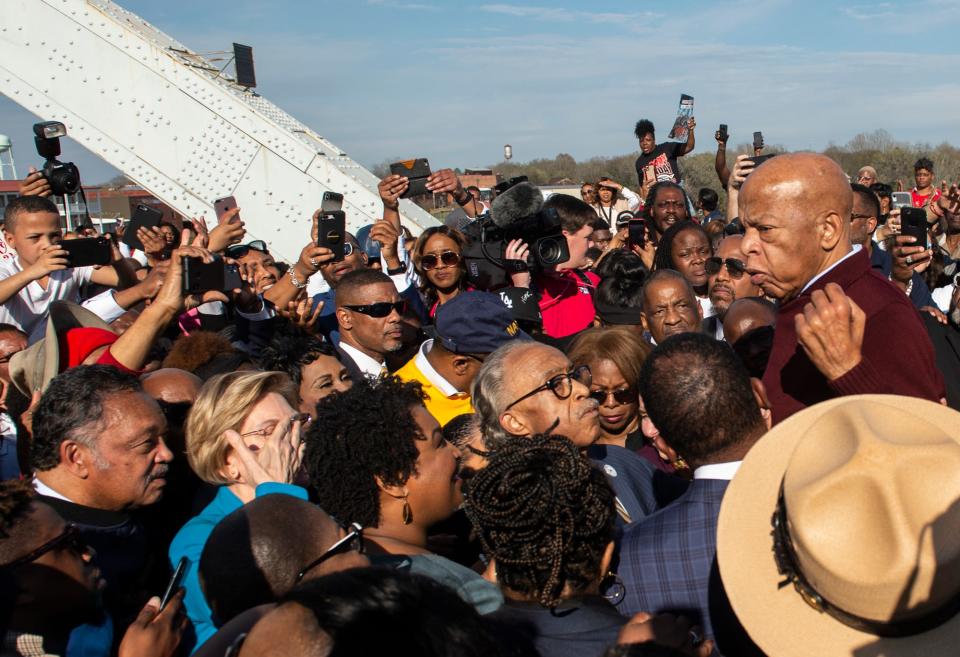 U.S. Rep. John Lewis speaks on the Edmund Pettus Bridge in Selma, Ala., on Sunday, March 1, 2020. 