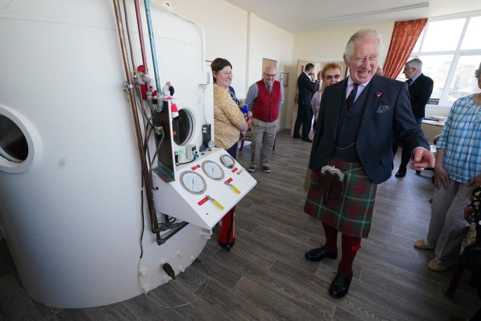 The Prince of Wales, known as the Duke of Rothesay when in Scotland, is shown the centre’s barochamber (Andrew Milligan/PA) (PA Wire)
