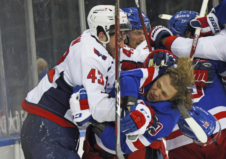 Washington Capitals' Tom Wilson (43) takes a roughing penalty during the second period against New York Rangers' Artemi Panarin (10) in an NHL hockey game Monday, May 3, 2021, in New York. (Bruce Bennett/Pool Photo via AP)