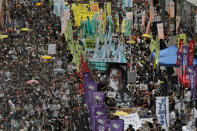 <p>Protesters carry a large image of jailed Chinese Nobel Peace laureate Liu Xiaobo as they march during the annual pro-democracy protest in Hong Kong, Saturday, July 1, 2017. (Photo: Vincent Yu/AP) </p>