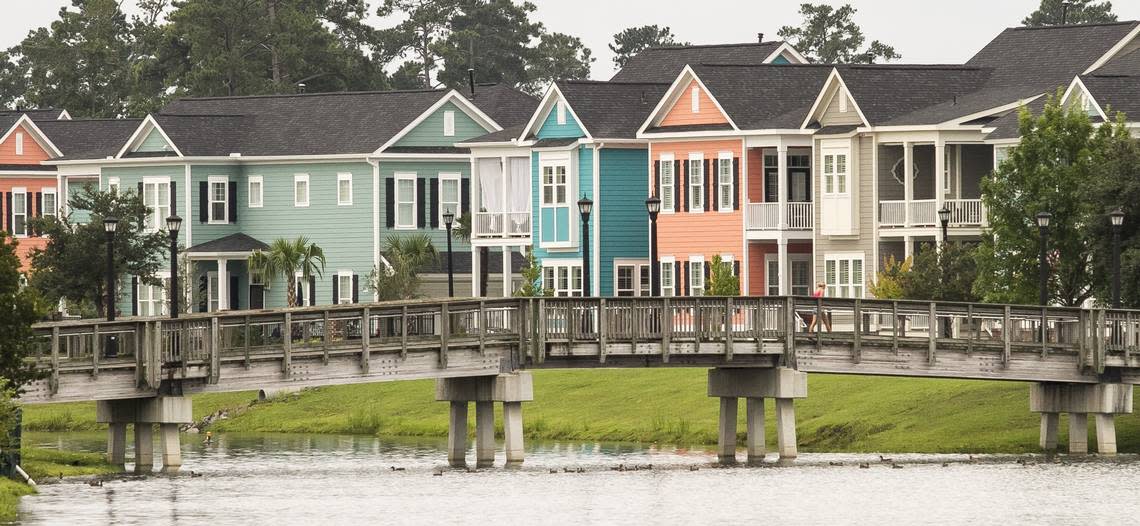 Residential homes line a lake at Market Common on land that once was part of the Myrtle Beach Air Force Base.