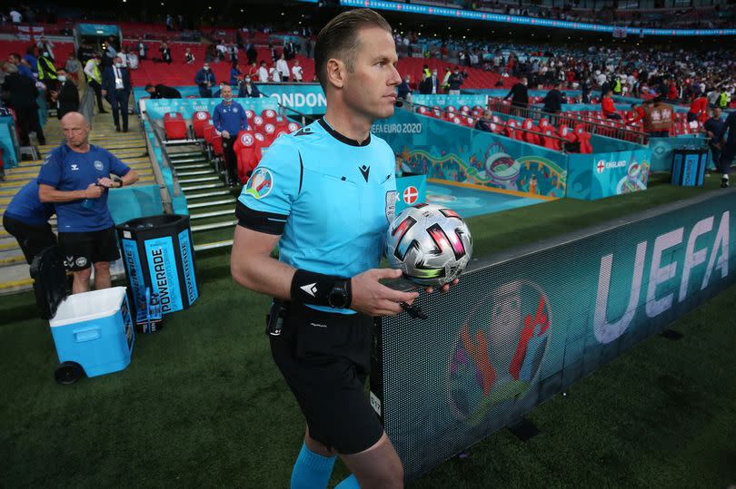 Referee Danny Makkelie takes to the field