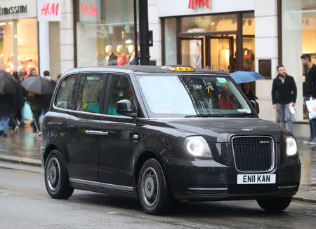 A London Electric Vehicle Company (LEVC) TX electric black taxi driving on the streets of central London, Britain, April 2, 2018. REUTERS/Hannah McKay - RC1456E0D700