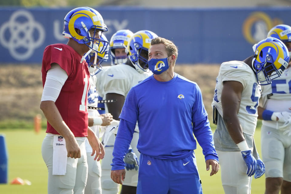 Los Angeles Rams head coach Sean McVay, center, talks to quarterback Jared Goff during an NFL football camp practice Wednesday, Aug. 19, 2020, in Thousand Oaks, Calif. (AP Photo/Marcio Jose Sanchez)