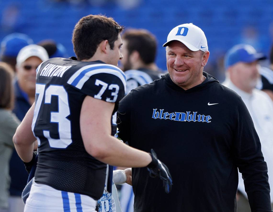 Duke head coach Mike Elko congratulates Anthony Hinton during a Senior Day ceremony prior to the Blue Devils’ final regular season game at Wallace Wade Stadium on Saturday, Nov. 26, 2022, in Durham, N.C.