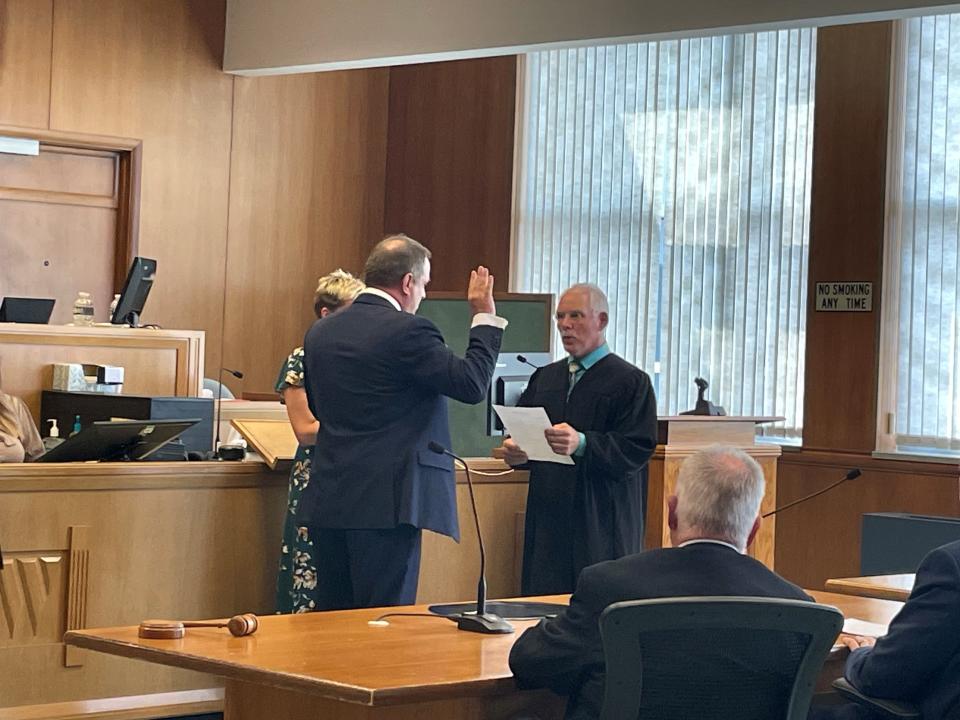 Wood County Branch 1 Circuit Judge Greg Potter swears in new Branch 4 Circuit Judge Tim Gebert Friday afternoon.