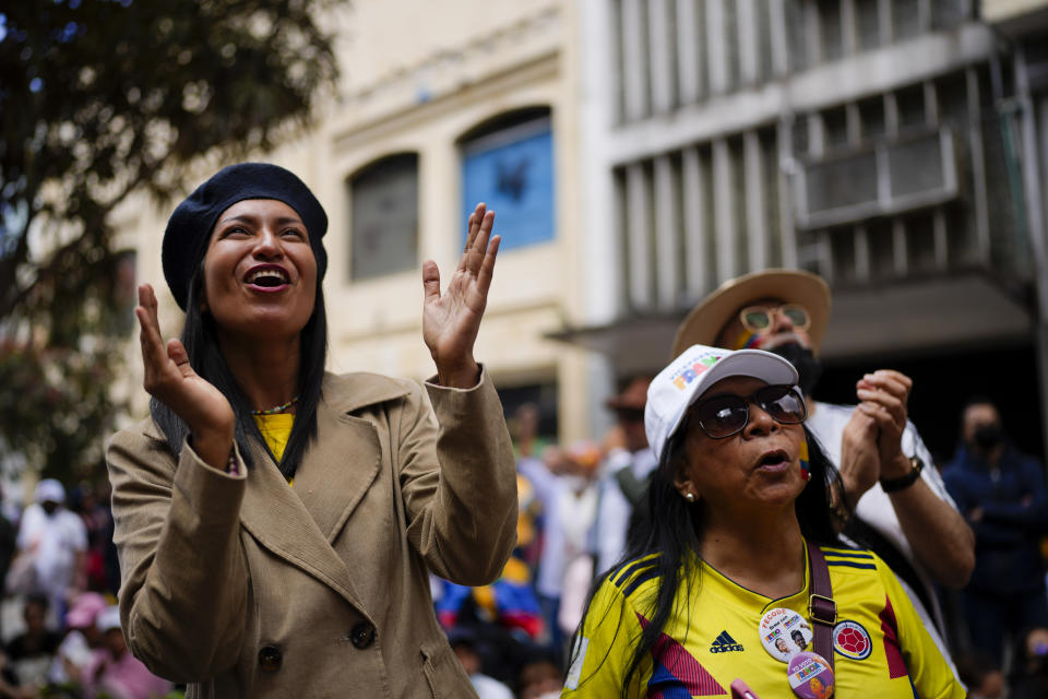 Supporters of new President Gustavo Petro watch his swearing-in ceremony on a giant TV screen near the the Bolivar square in Bogota, Colombia, Sunday, Aug. 7, 2022. (AP Photo/Ariana Cubillos)