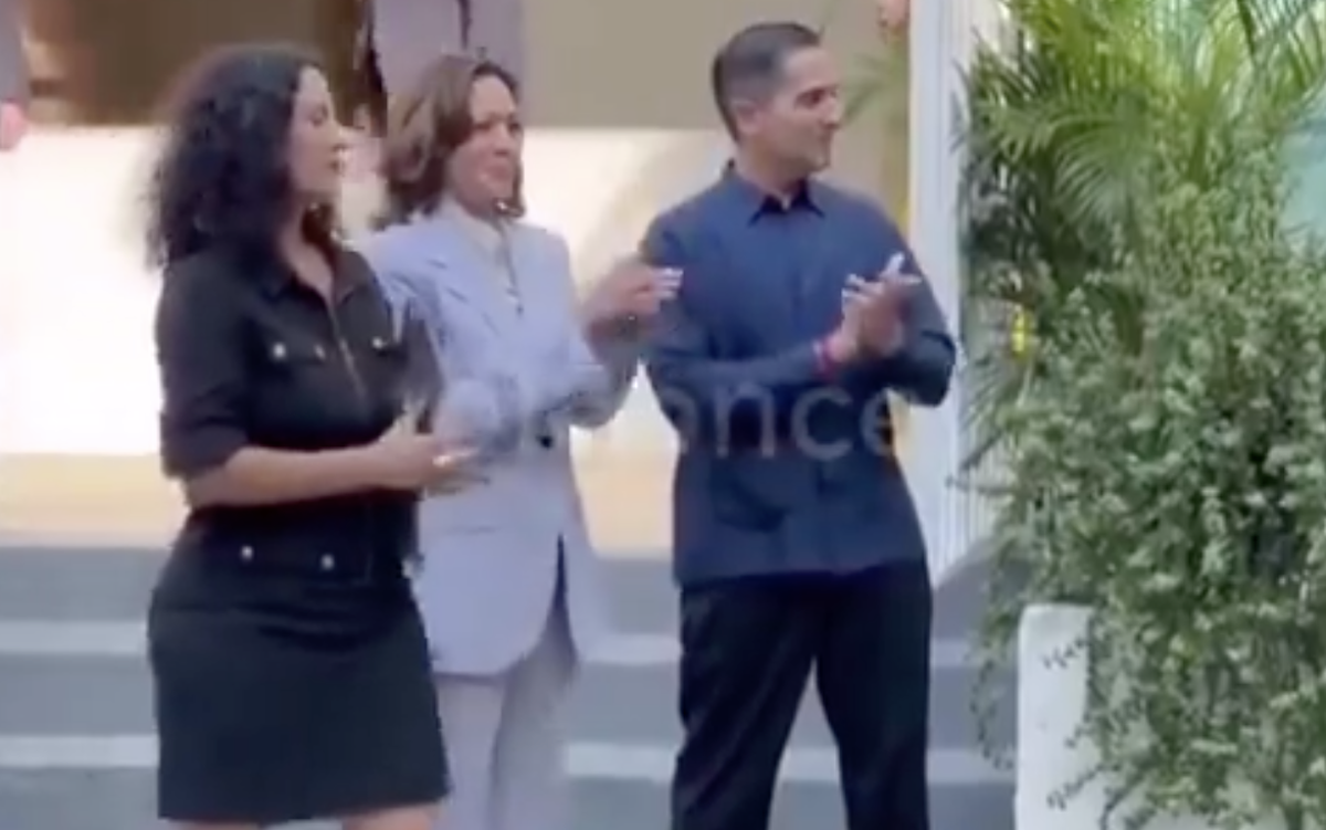 Kamala Harris was seen gleefully clapping and smiling as Puerto Rican protesters sang (Sky News Australia)